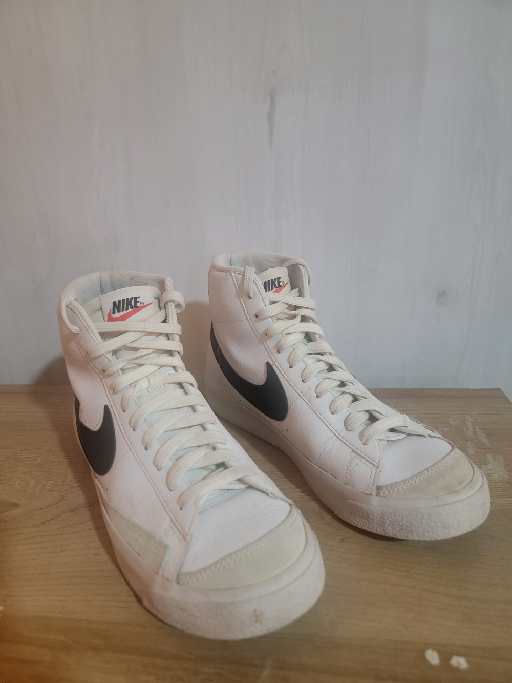 Nike Men’s White High-Top Sneakers with Black Swoosh